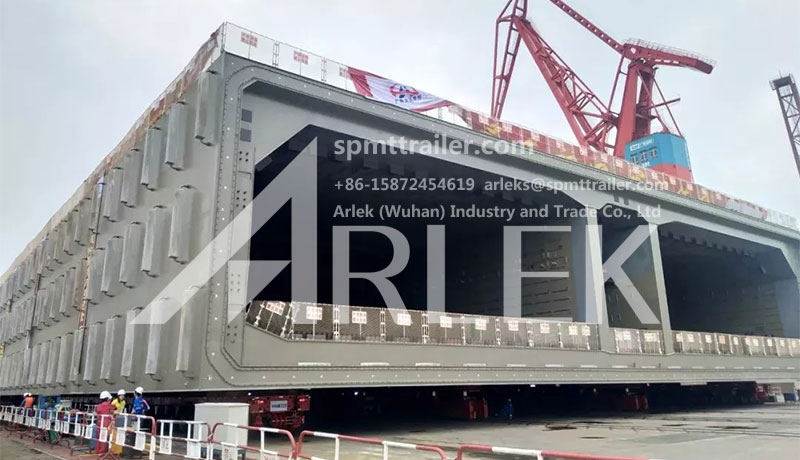 super heavy equipment carriers completes 12000-ton immersed tube tunnel steel shell transport