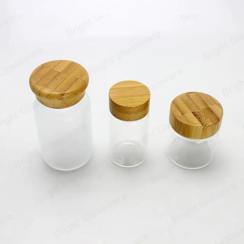 Frasco de vidrio esmerilado transparente vacío de lujo con tapa de bambú frasco cosmético con tapa de bambú de rosca para el cuidado de la piel