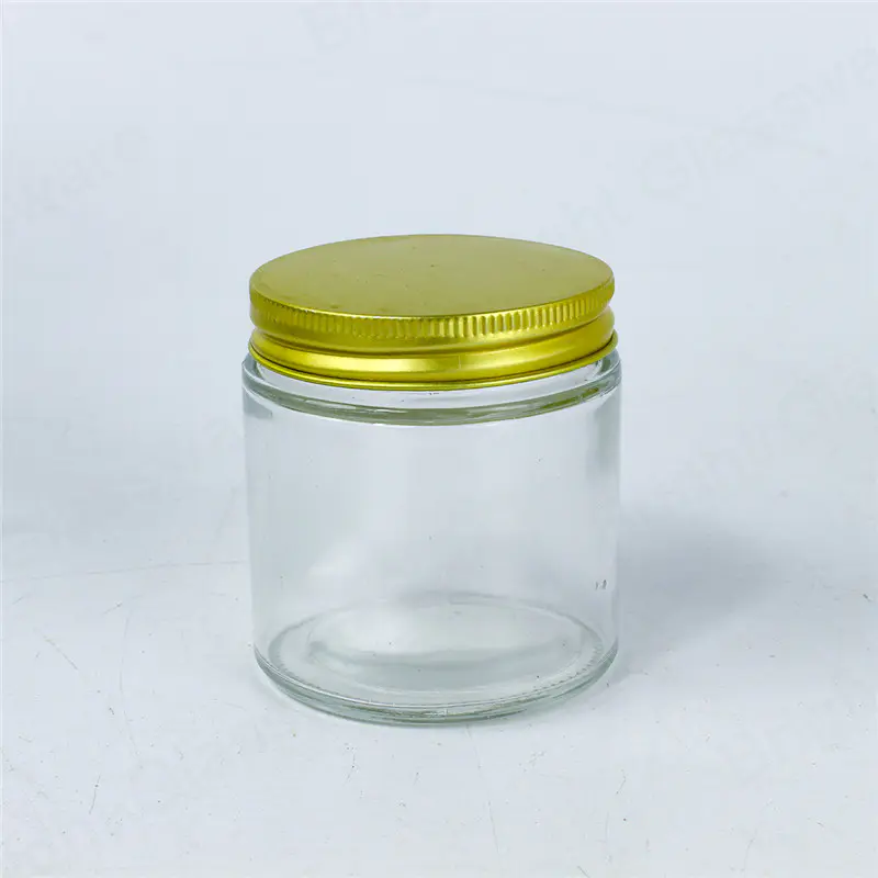 Frasco de vidrio transparente de 4 oz con tapa dorada para almacenamiento en la cocina