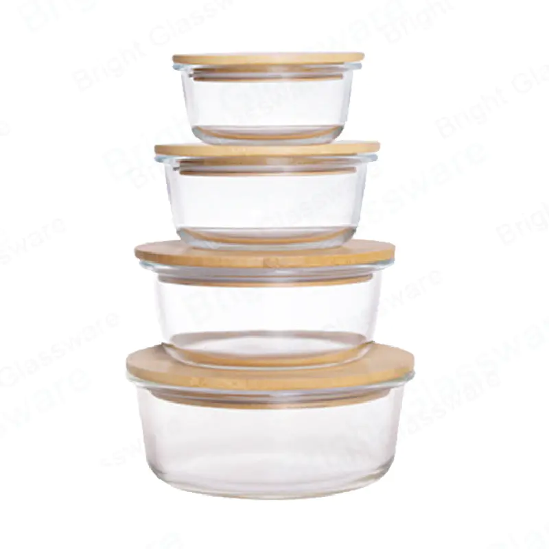 Caja de conservación de vidrio resistente al calor de forma redonda Recipiente de vidrio para alimentos borosilicato con tapa de madera