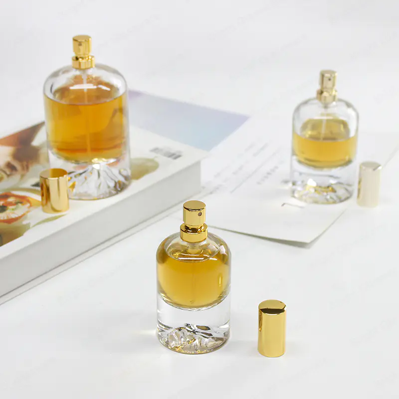 Venta al por mayor personalizada de la botella de aerosol de perfume de vidrio de base pesada con cabeza de pulverización de oro