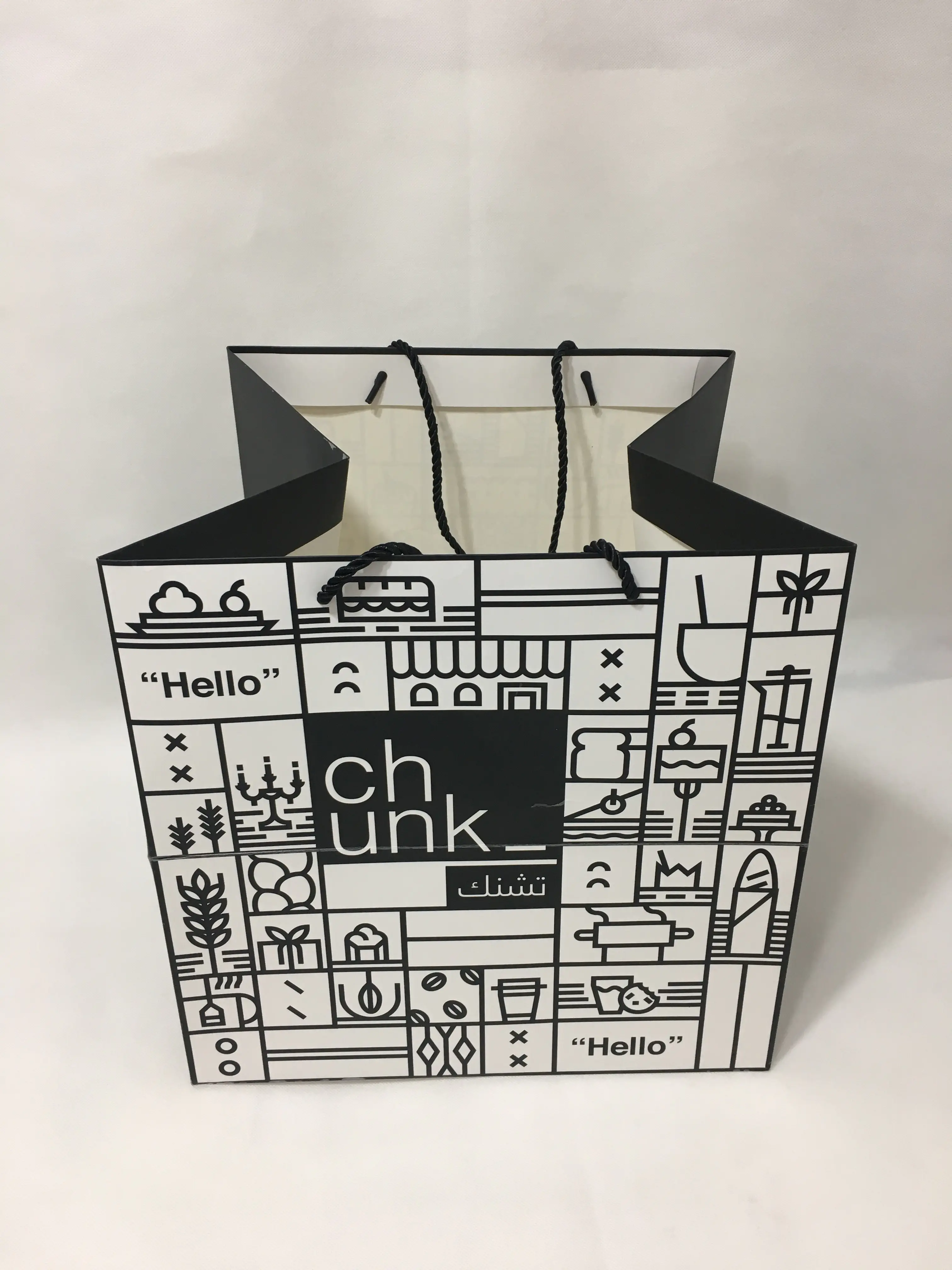 square size white cardboard paper bag with triangle shape bottom with pp rope handle cmyk color printed matt film laminated