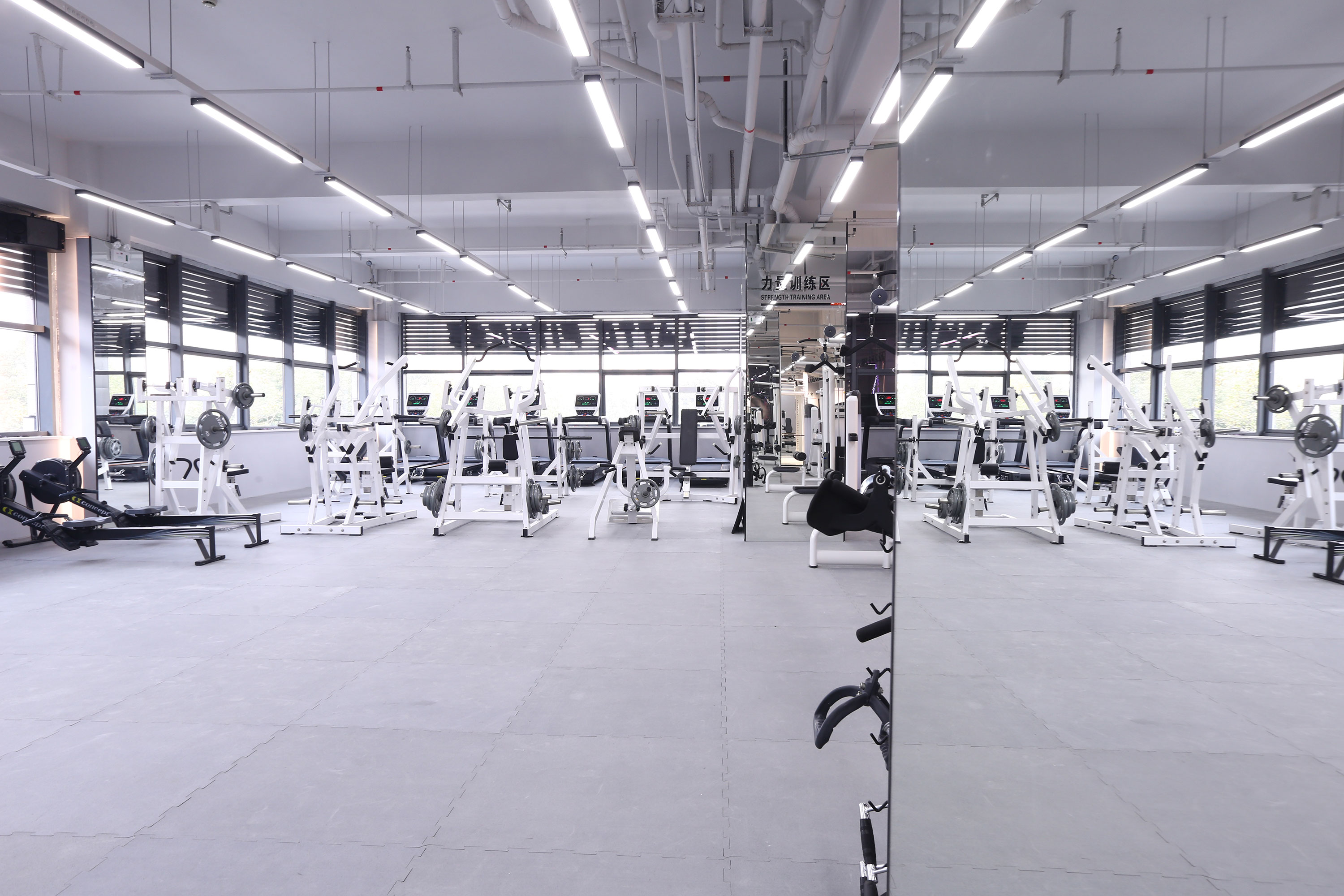 What kind of flooring is recommended for the gym? Are there any differences between the wooden flooring in the gym and the wooden floors in other spaces?