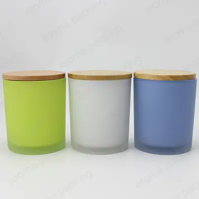 竹のふたが付いている蝋燭作りのための良質の多色のマットなガラス蝋燭の瓶