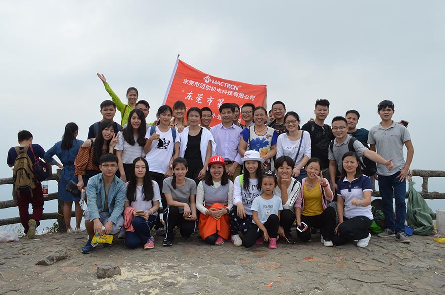 mactron tech laser team joint photo on top of yinpin mountain