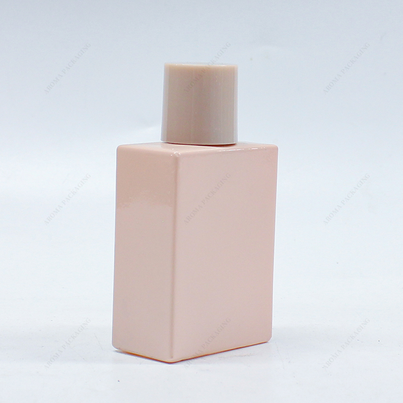Frasco de perfume de vidrio rosa con tapa