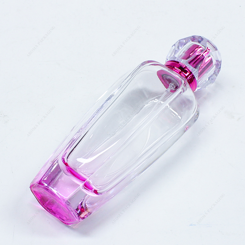 Frasco de perfume de vidrio rosa con tapa