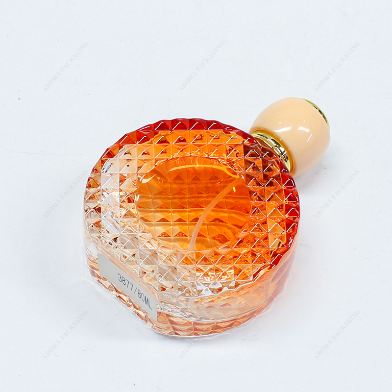 Gradient yellow embossed glass perfume bottle with lid