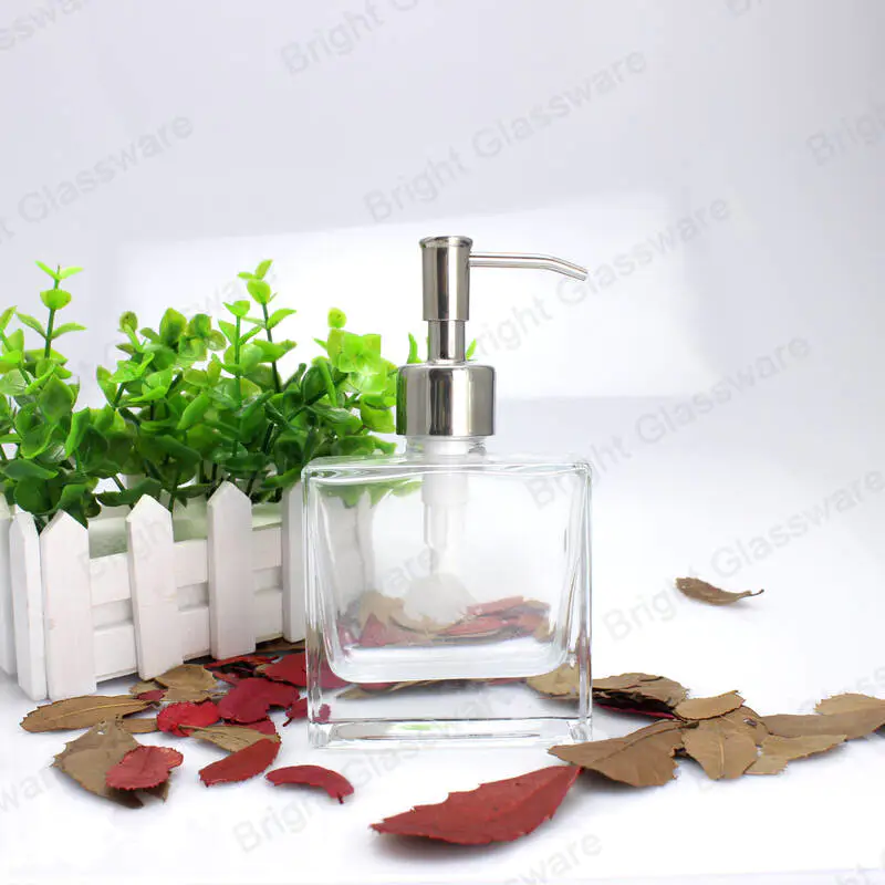 bathroom use empty glass hand sanitizer bottle square shaped with stainless steel lotion pump dispenser 