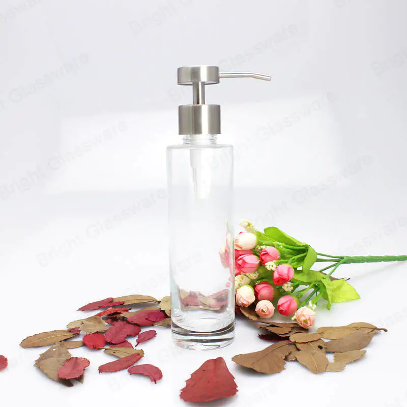 transparent refillable essential oil glass bottle for shampoo with rustproof rubbed sainless steel pump