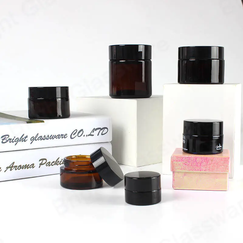 Factory cheap price stocked 5ml 10ml 20ml 25ml 30ml 85ml amber glass cosmetic jars with black plastic cap wholesale
