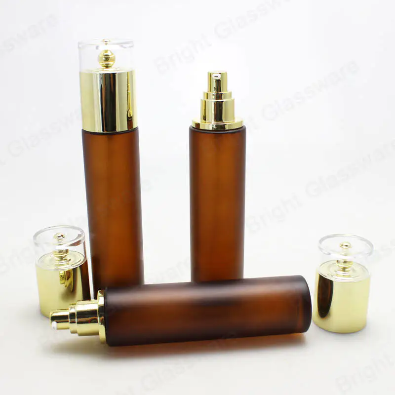 luxury 100ml amber glass lotion bottles serum cosmetic pump bottle with golden cap