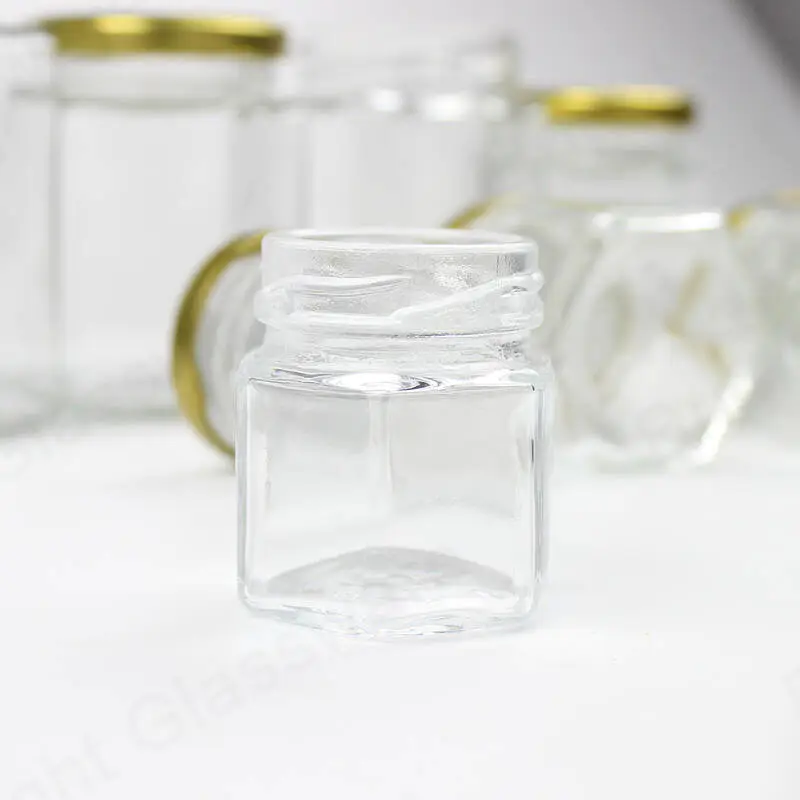 China supplier cheap hexagon glass honey jar with screw lid