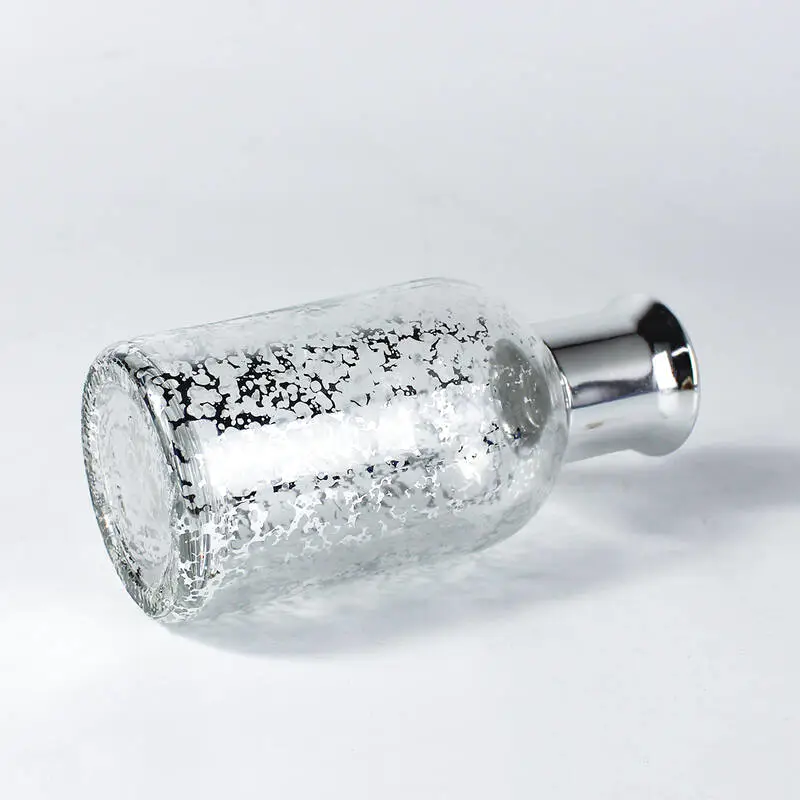 Botella difusora de lengüeta plateada brillante con palitos de fibra
