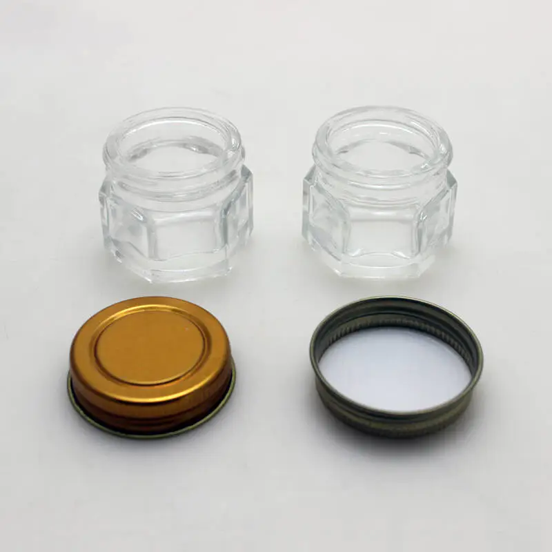Frasco hexagonal transparente con tapa de metal frasco de vidrio para crema cosmética