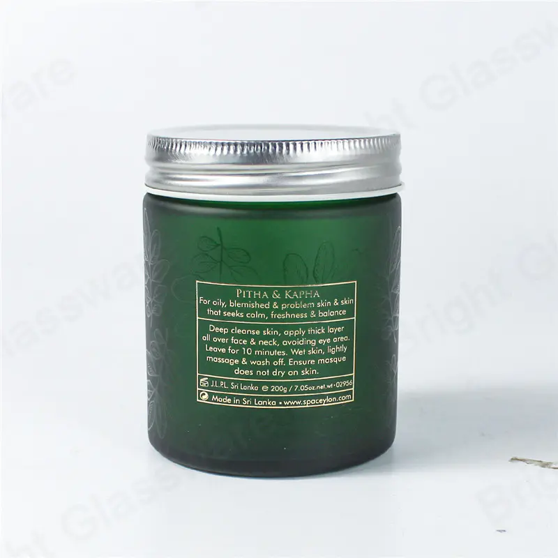 green straight sided 16 oz glass cosmetic jar with aluminum lid