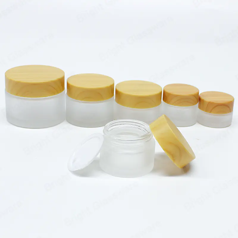 Amazon Best Seller Tarro de crema de vidrio esmerilado personalizado con tapa de bambú de plástico de tornillo