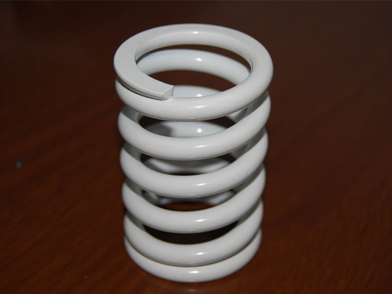 What are the characteristics and advantages of extension springs?