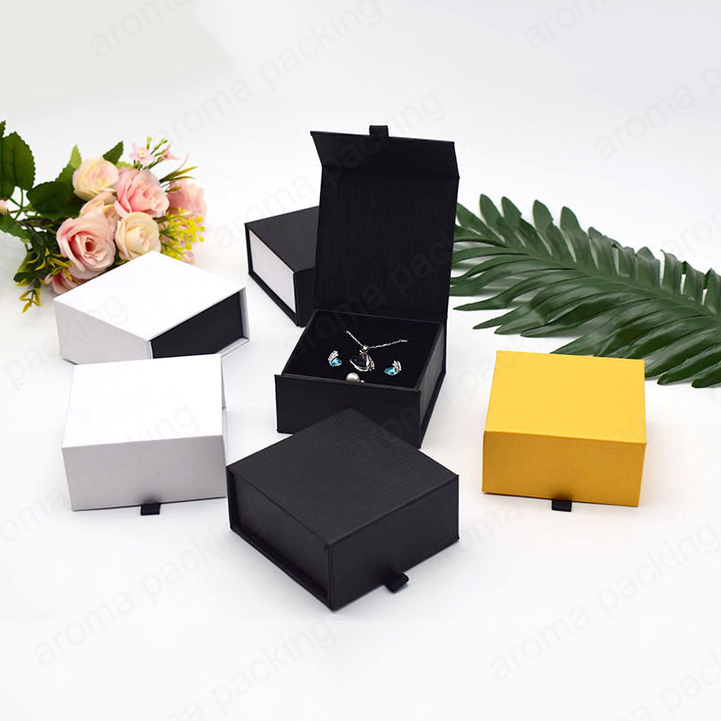 磁気およびリボンが付いている卸し売りの贅沢な黒白い黄色の宝石箱の包装