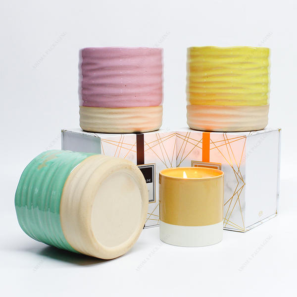 卸し売りピンク緑黄色の円形の浮彫りにされた陶磁器の蝋燭の瓶は蝋燭のための箱が付いている