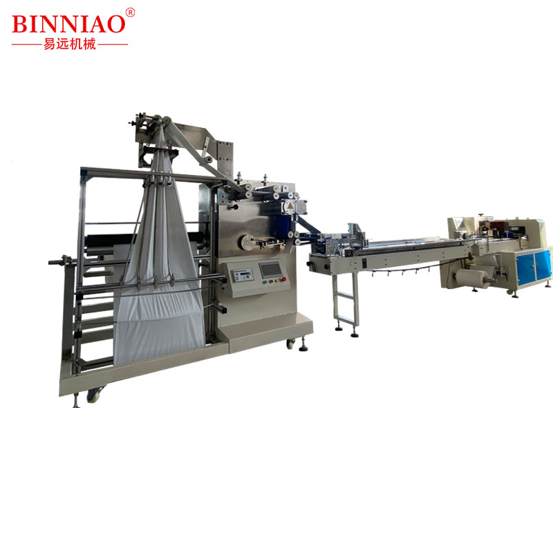 Non-woven folding, slitting and packaging machine